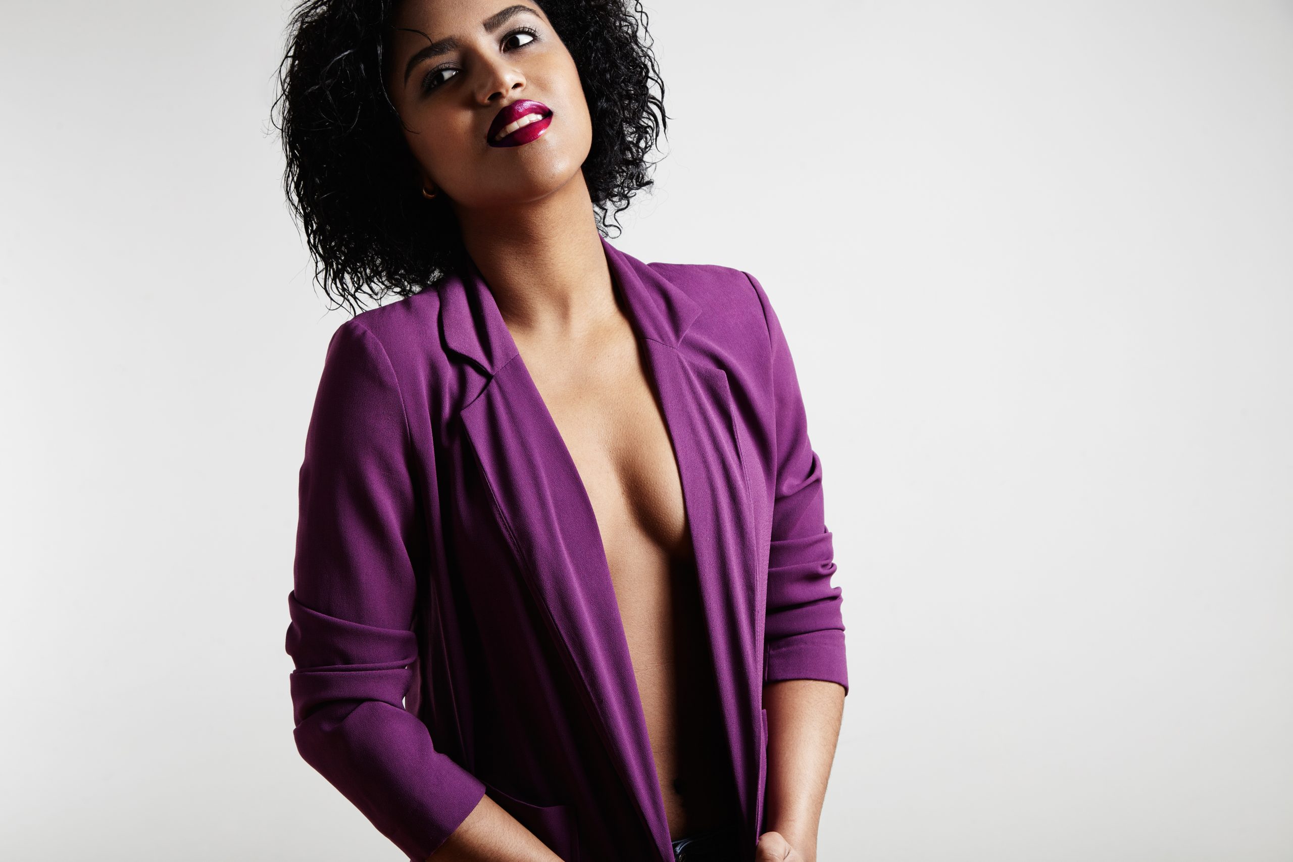 nude woman in bright jacket